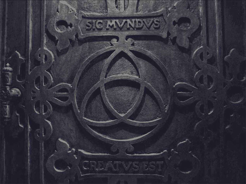 DARK Triquetra symbol on Sic Mundus door.